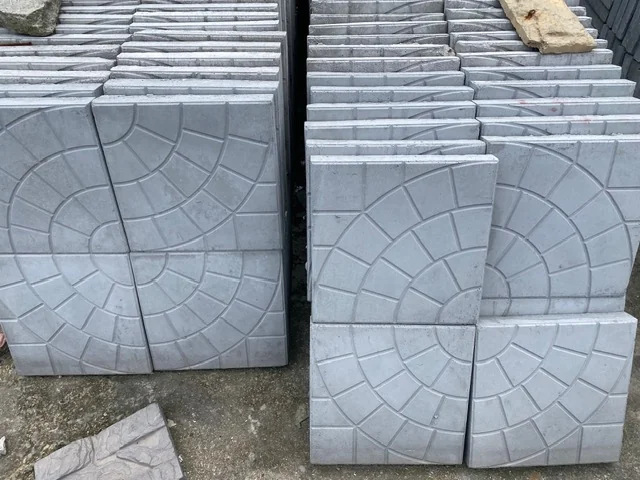 Concrete paving stones forming a driveway and paved surface