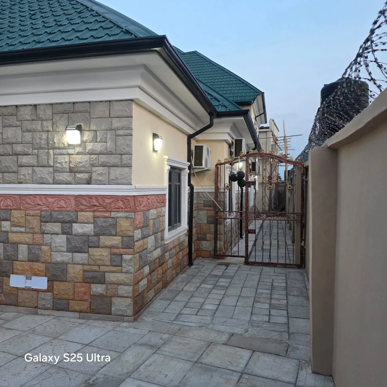 Modern driveway paving installation with brick pavers